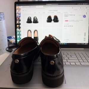 Cole Haan Shiny Black Loafers with Gold Accent  women’s Treena Lug Loafers